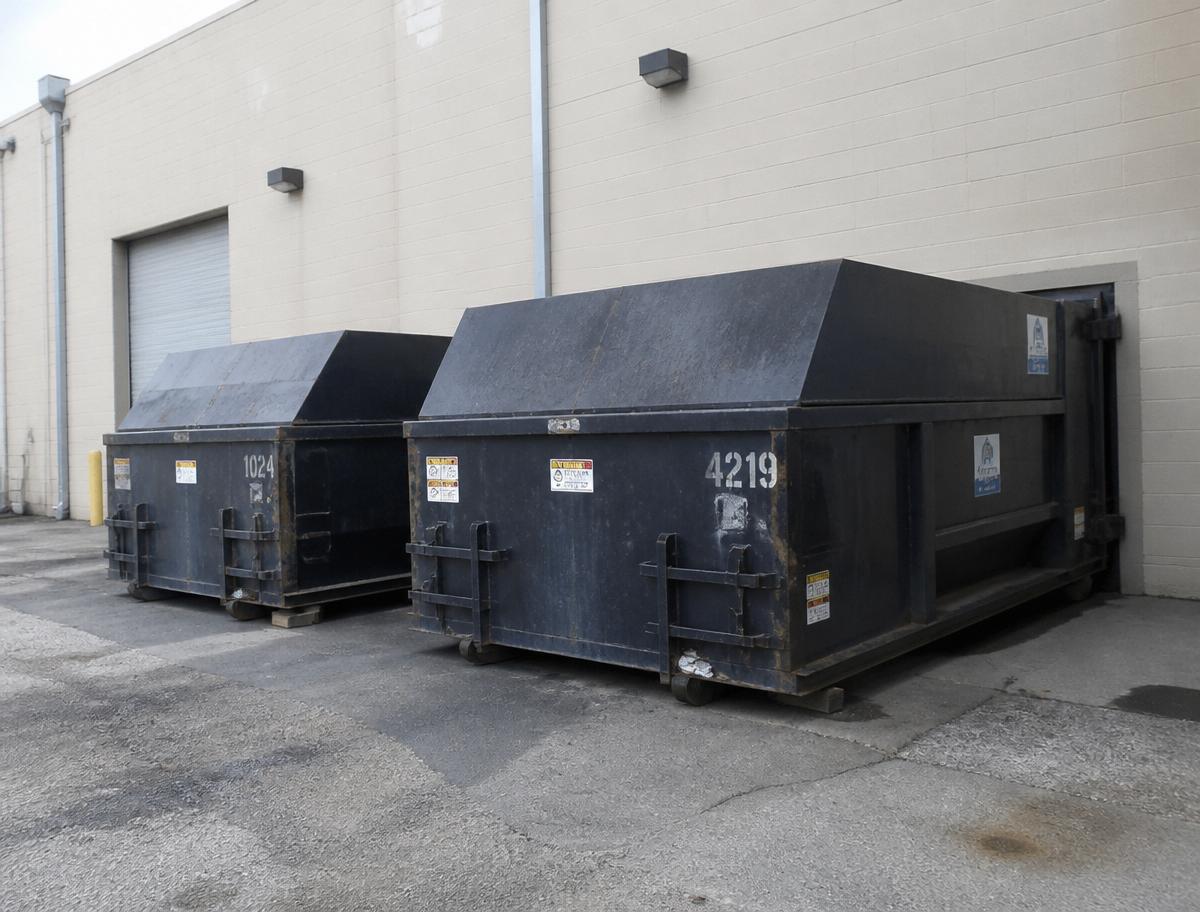 Commercial trash bins ready for dumpster washing and deodorizing service